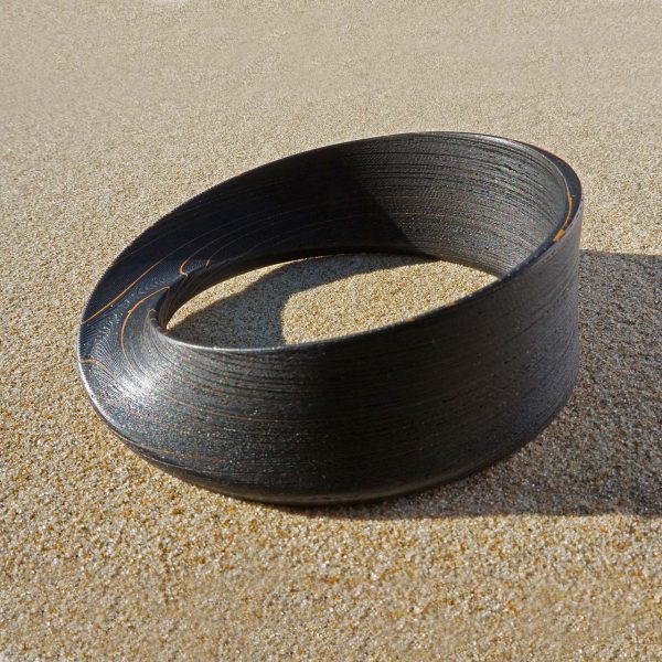 immagine per OITO BRACCIALE NERO CON STRIATURE BRONZO